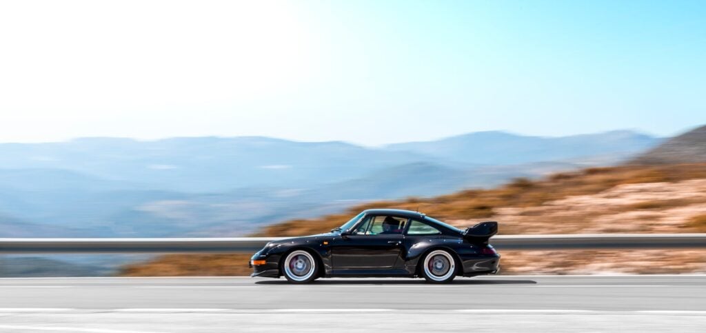 dynamic supercar driving on mountain road
