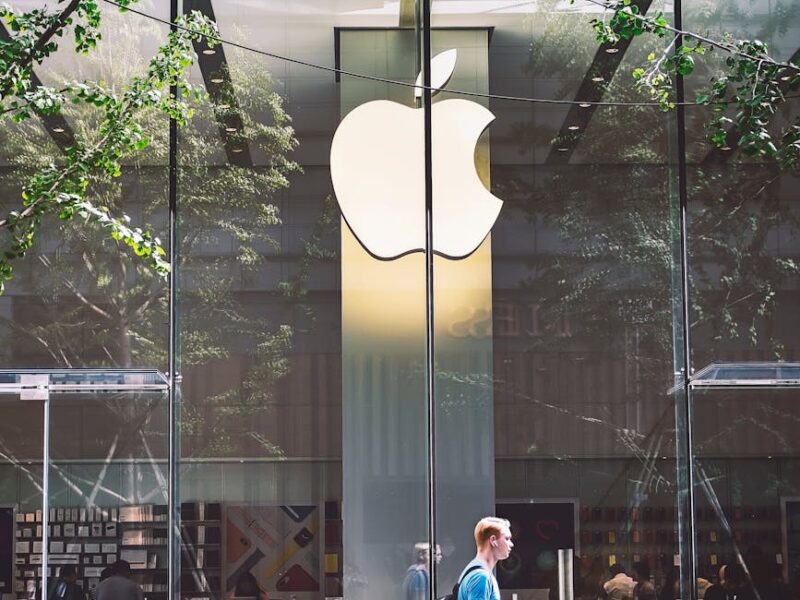 man passing an apple store