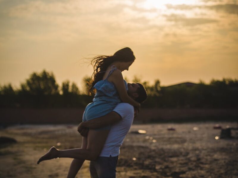 hugging couple beside seashore