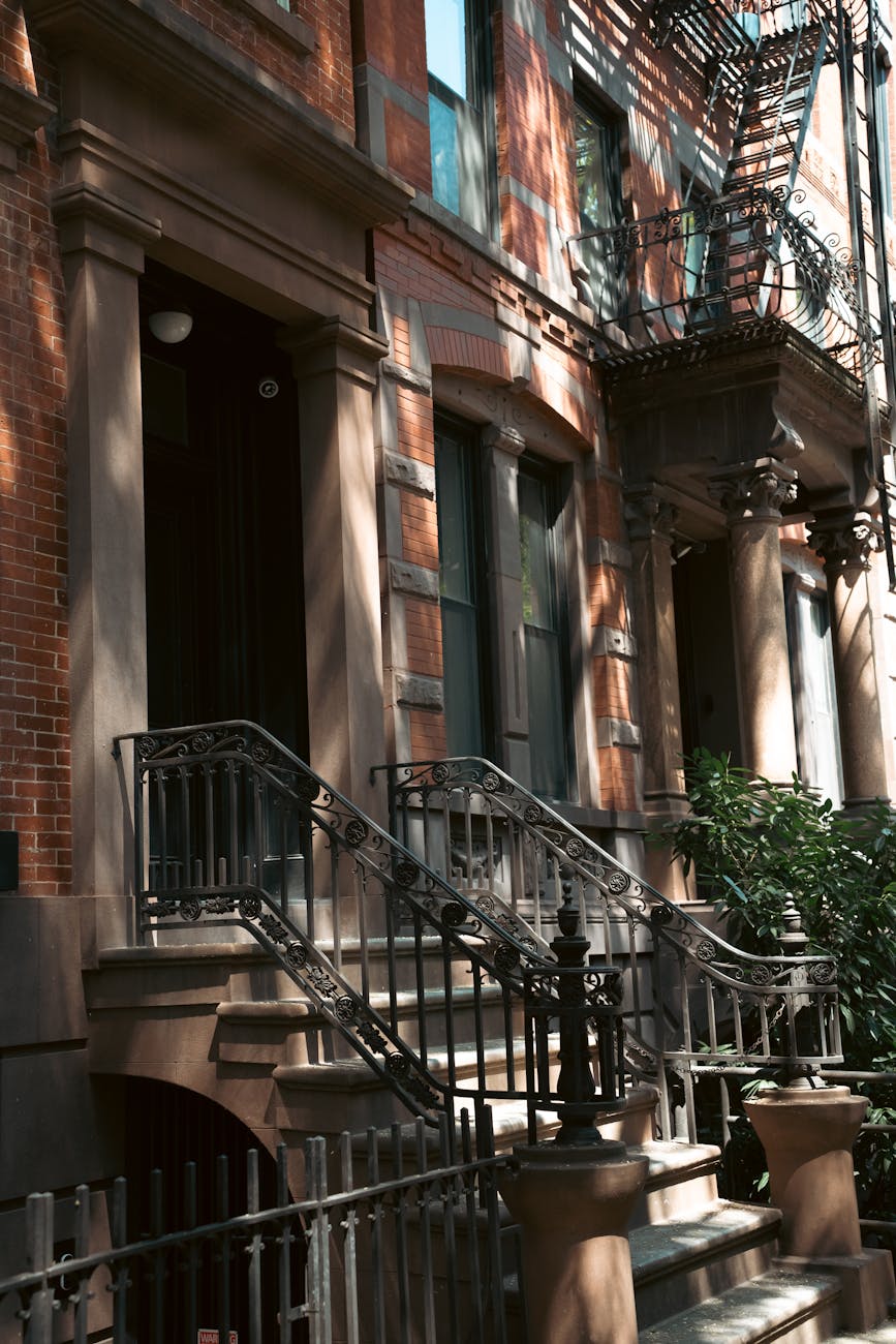 elegant brownstone building facade with iron railings
