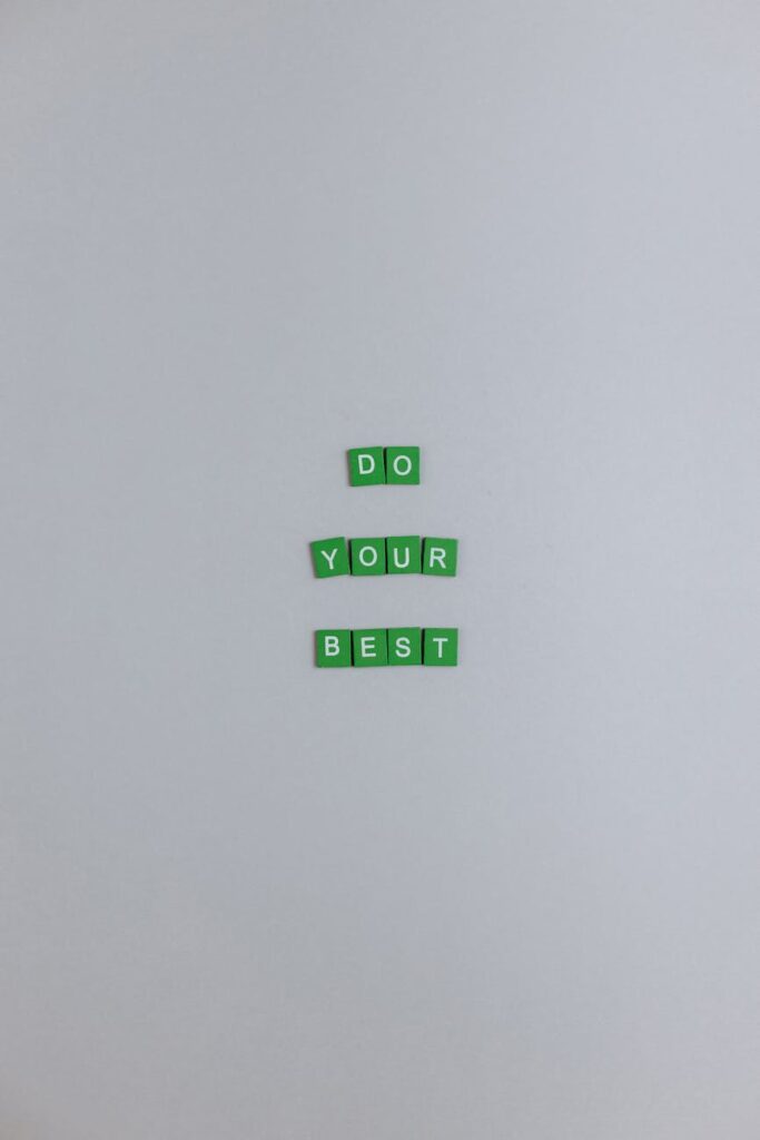 green scrabble tiles on a white surface
