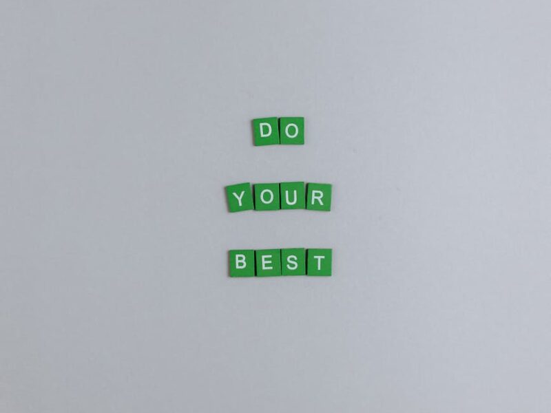 green scrabble tiles on a white surface