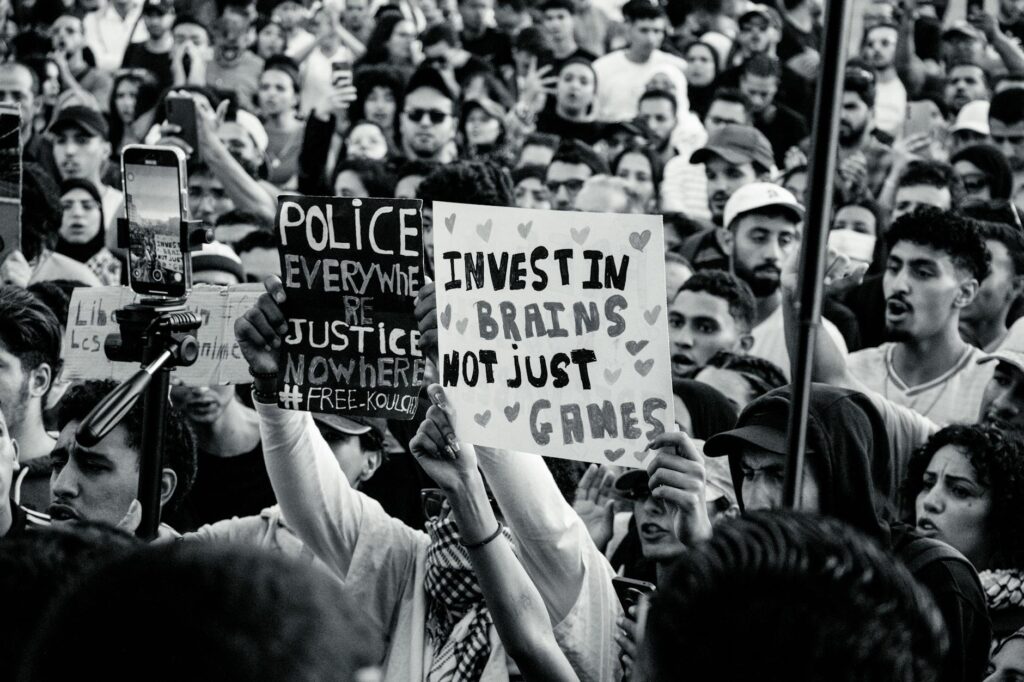 black and white protest with creative signs