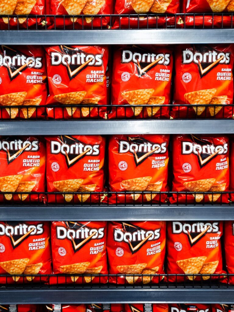 rows of doritos on shelf in brazilian store
