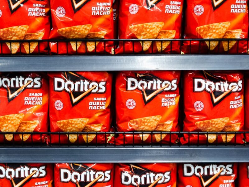 rows of doritos on shelf in brazilian store