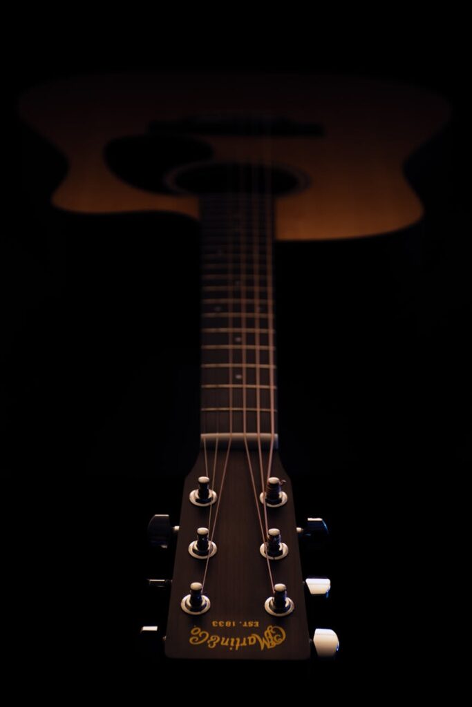 photography of dreadnought acoustic guitar