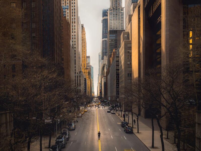 time lapse photography of vehicles passing on road