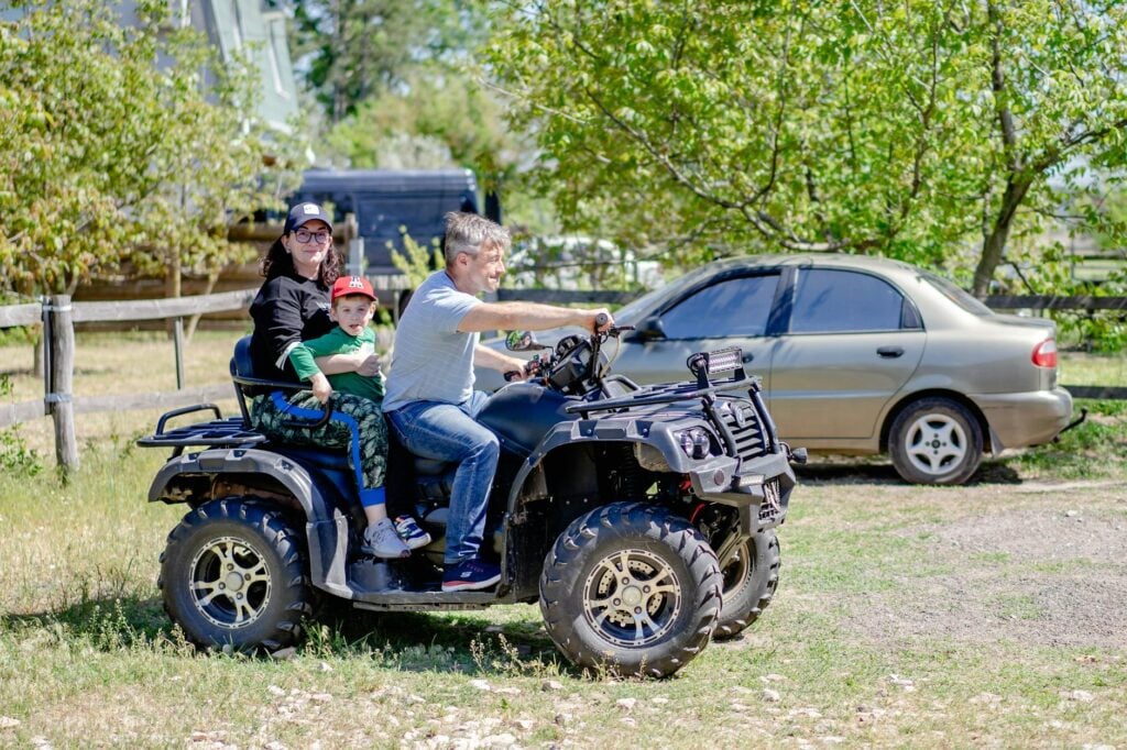 a family riding an atv