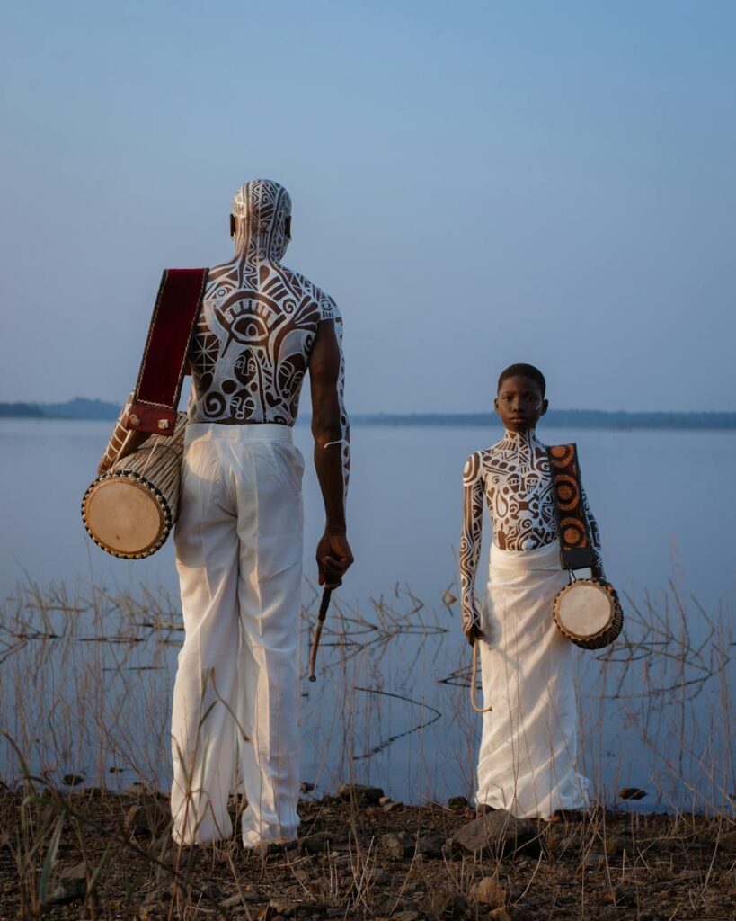 traditional drummers by lagos lagoon at sunset