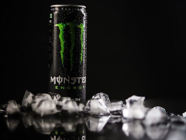 monster energy tin can on black surface