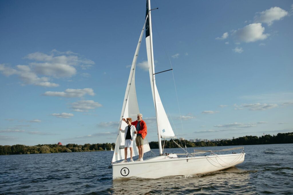 a boy sailing with his grandpa