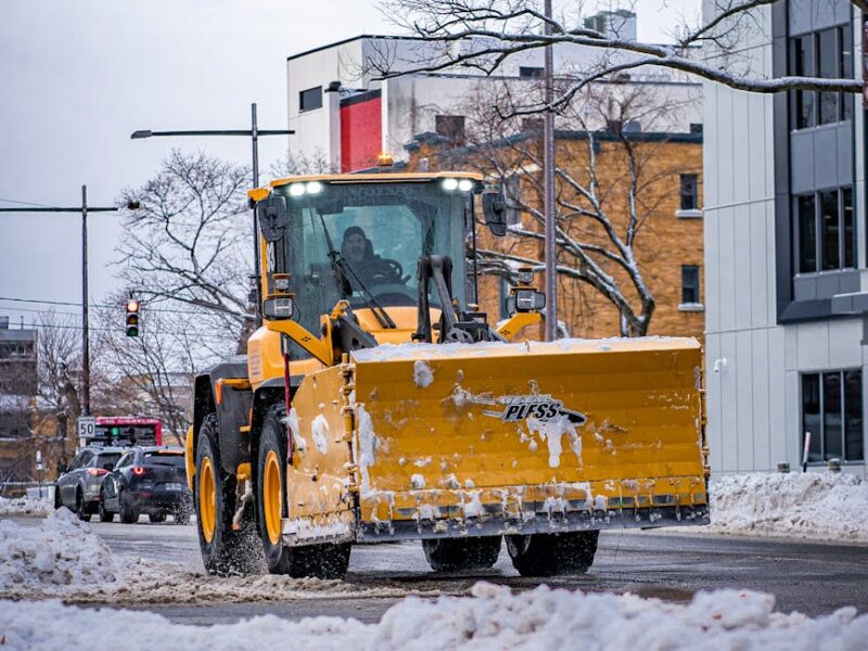 yellow snow plow truck on road