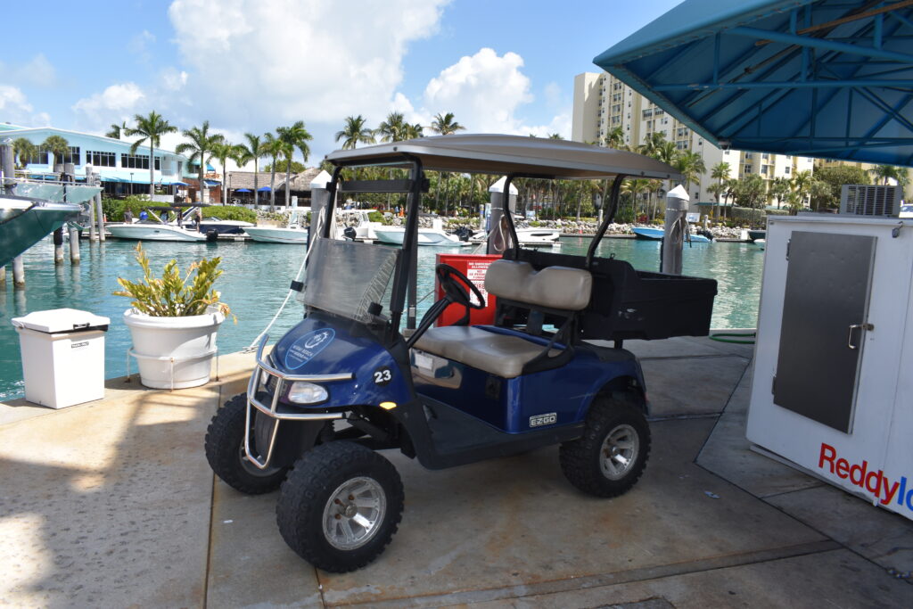 Dock Master’s golf cart parked outside the marina office at Miami Beach Marina in Miami Beach, Florida, March 2026