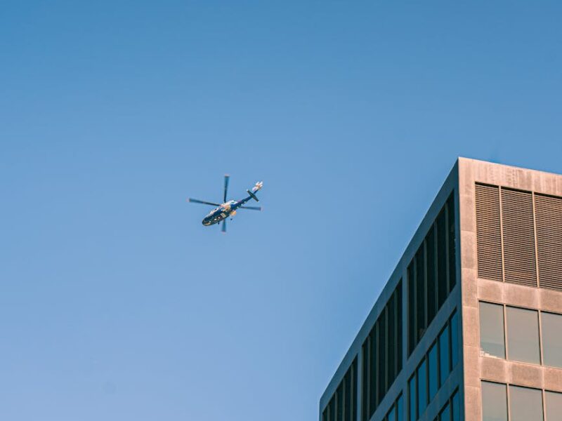aerial view of helicopter over grand rapids skyline