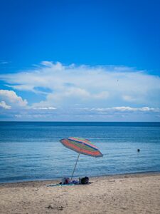 sunny beach day with colorful umbrella