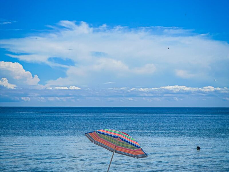 sunny beach day with colorful umbrella