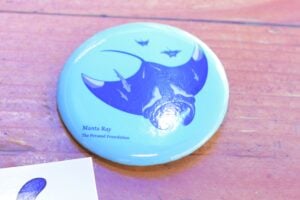 Santa Monica, CA, USA, April 2025: Gwenevere founder of The Persaud Foundation - button she gave to Presence News at her monthly beach cleanup event.