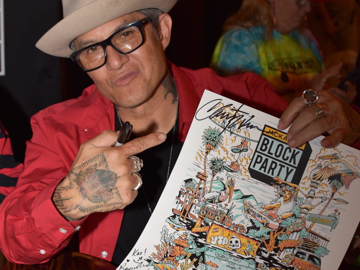 Ventura, CA, USA, May 2026: Christian Hosoi autographs poster for fans at meet and greet Jackalope event.