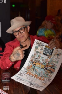 Ventura, CA, USA, May 2026: Christian Hosoi autographs poster for fans at meet and greet Jackalope event.