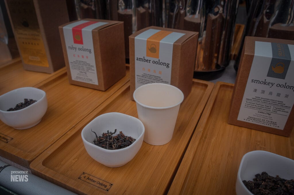 Tea samples and packaged oolong teas are displayed at the Silk & Jade vendor booth during Fiesta Hermosa in Hermosa Beach. (Photo by Maria Cornejo / Presence News)