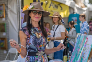 Coronado, CA, USA, May 2026: In photo is Ginger Lou during live art creation