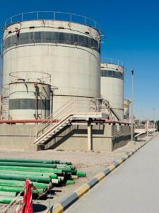 industrial storage tanks under clear blue sky