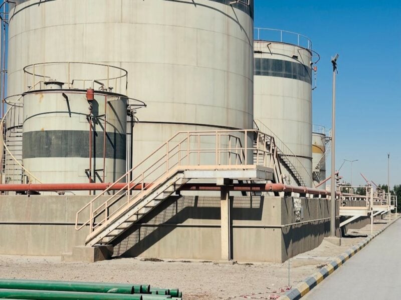 industrial storage tanks under clear blue sky