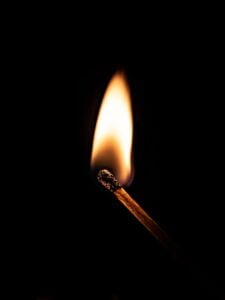 a lighted matchstick