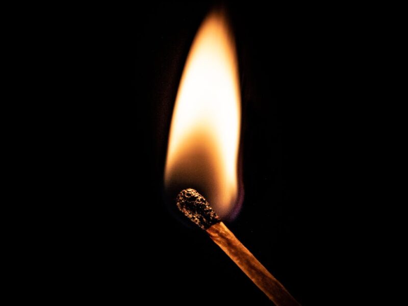 a lighted matchstick