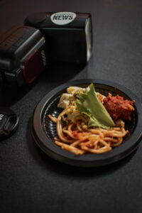 Los Angeles, CA, USA, June 2026: Presence News Camera Flash & food photo taken by Winston Ekpo