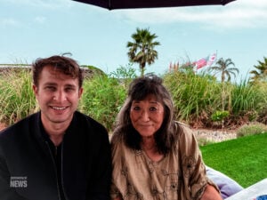 Malibu, CA, USA, June 2026: Kasdyn from Presence News in the hills of Malibu talking with locals on residential property under construction to rebuild.