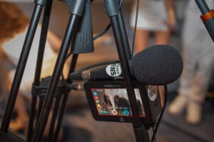 Beverly Hills, CA, USA, July 2026: Photo of Presence News microphone and external video recorder monitor at Soiree En Blanc event hosted by Modern Day Wife at Sofitel Hotel.