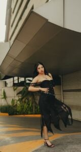 stylish woman in black dress street fashion