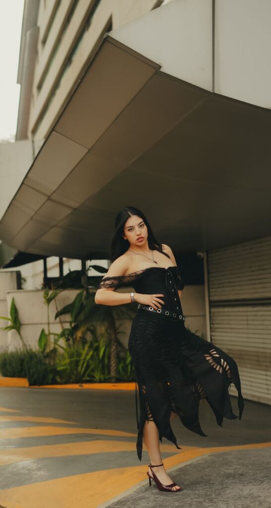 stylish woman in black dress street fashion