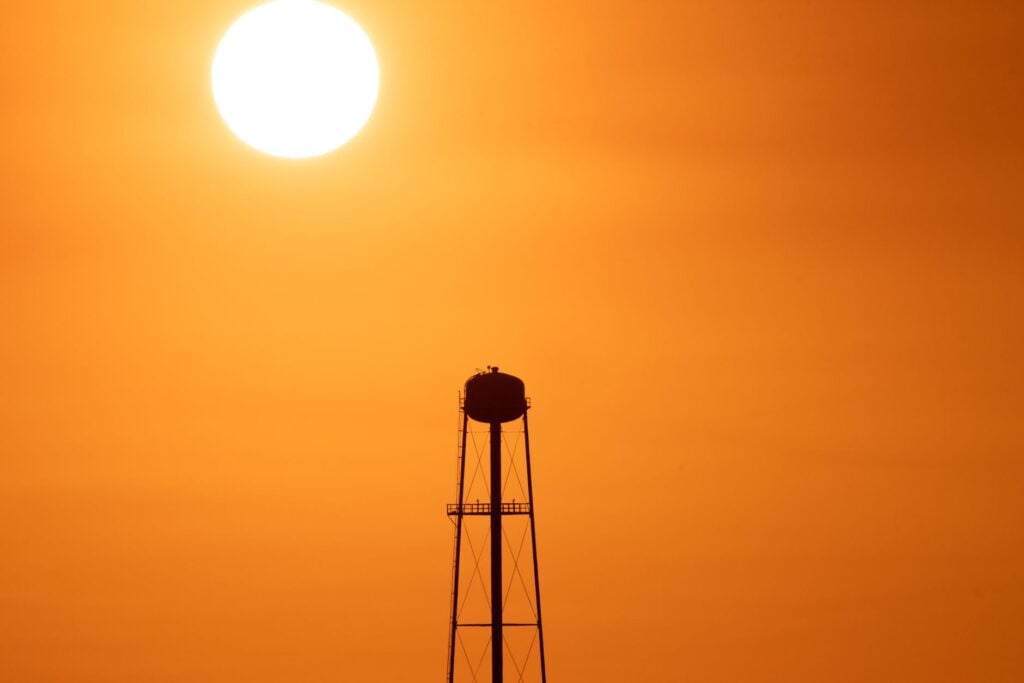water tower at sunset